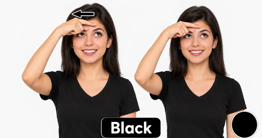 Woman in a black shirt demonstrates the ASL sign for black color by sliding her index finger across her forehead.