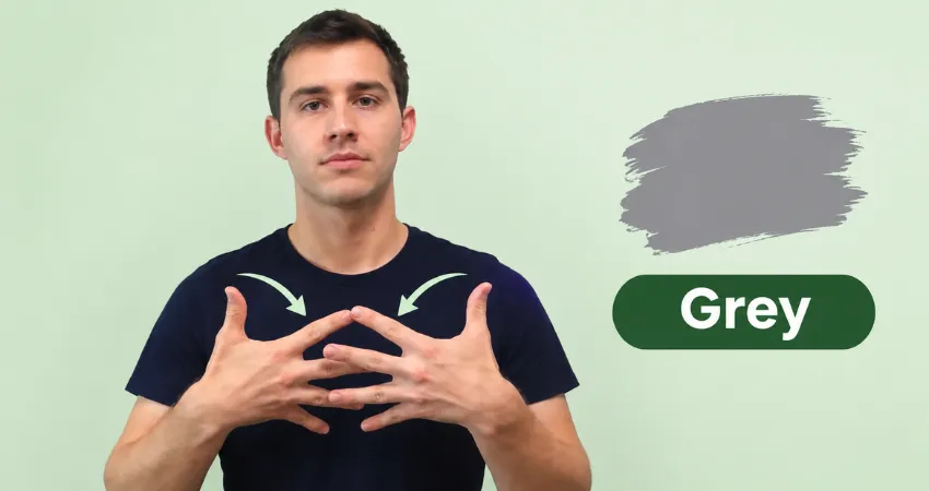 Man in a navy t-shirt shows the ASL sign for grey by brushing his fingers together as his hands pass each other.