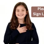 Child demonstrating 'please' in sign language by placing flat hand on chest, smiling.