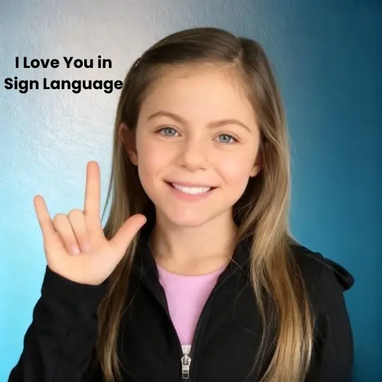 Girl making I Love You handshape in ASL with pinky, index finger, and thumb extended